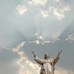 Picture of statue of Christ with arms outstretched.